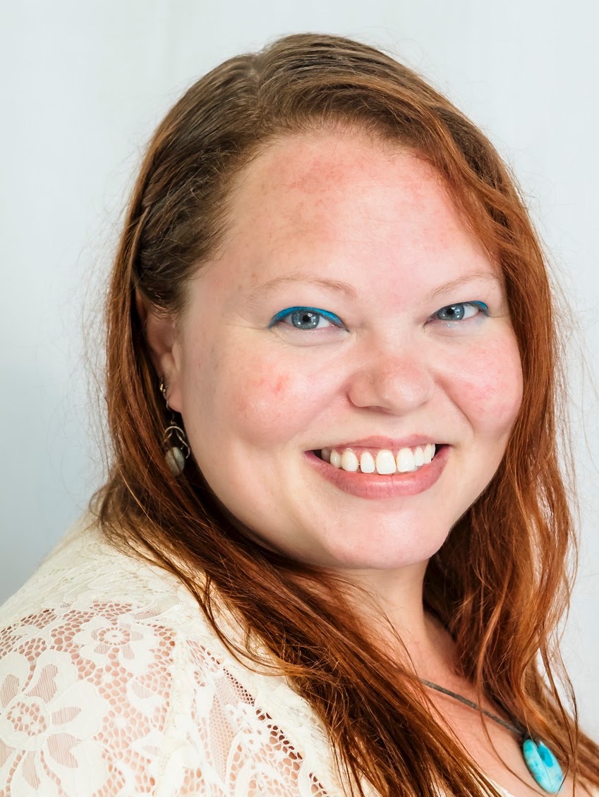 woman smiling red hair massage therapist in key west