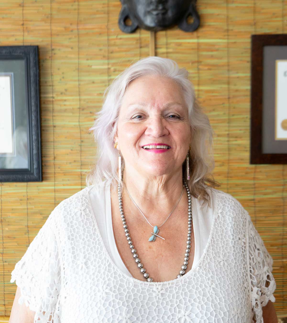 woman in white shirt bamboo background