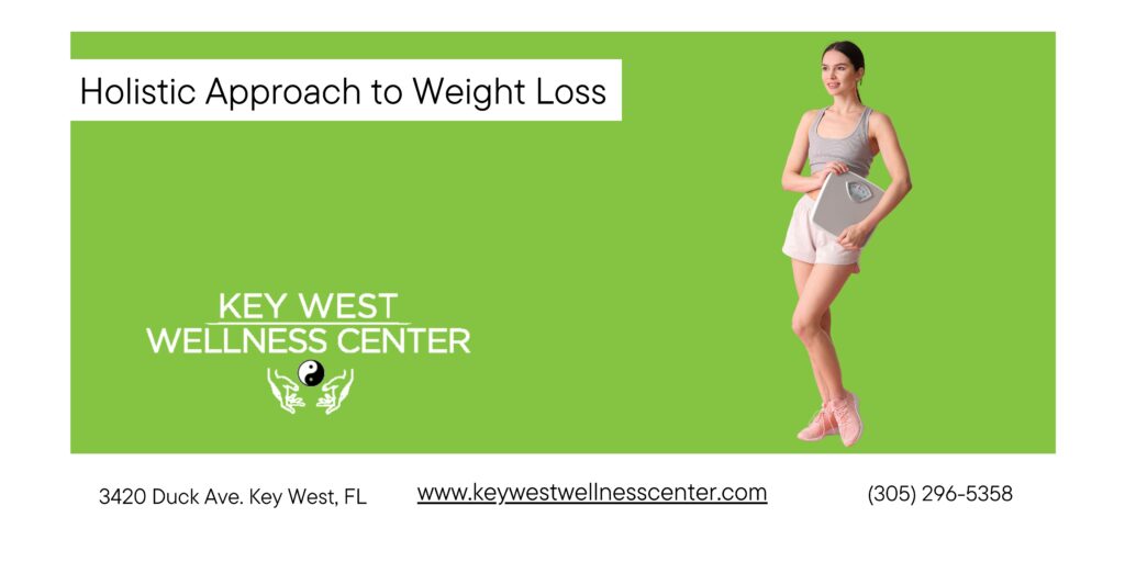 woman standing with a scale in hands wearing sports clothes